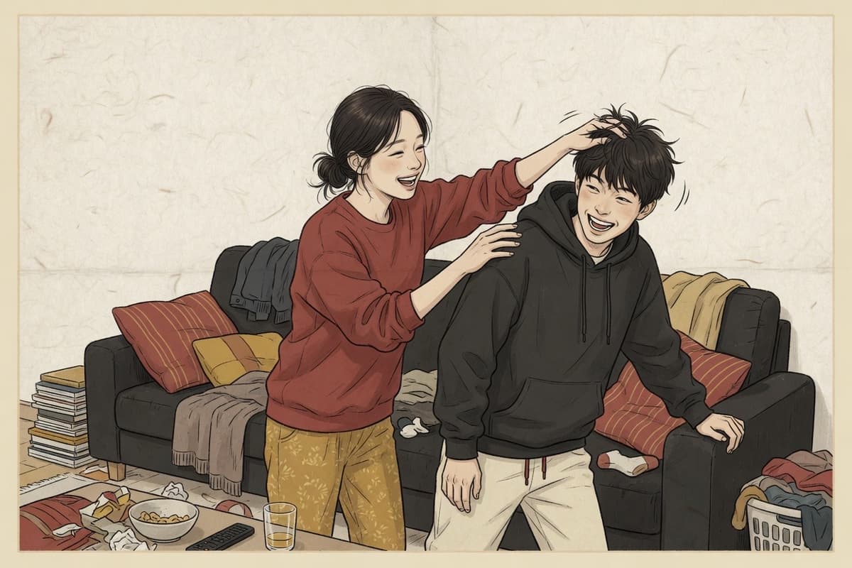 A young woman ruffles her younger brother’s hair as he ducks away grinning in a cluttered living room